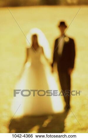 people, hands, blur, couple, holding, standing, outdoors View Large Photo Image Stock Photograph - people, hands, blur, couple, holding, standing, outdoors. Fotosearch