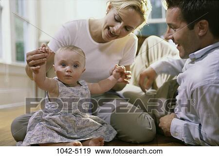 people, hands, sitting, baby, floor, stretching View Large Photo Image Stock Photo - people, hands, sitting, baby, floor, stretching. Fotosearch