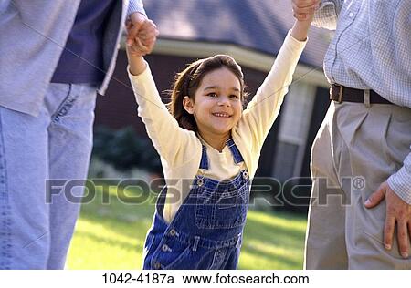 people, hands, smiling, Hispanic, swinging, holding, swing View Large Photo Image Stock Image - people, hands, smiling, Hispanic, swinging, holding, swing. Fotosearch