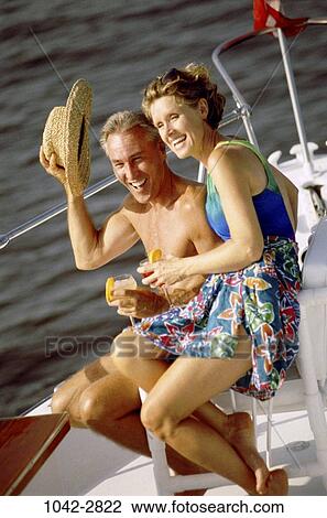 people, hat, couple, boating, lifestyles, outdoors, Middle-aged View Large Photo Image Stock Image - people, hat, couple, boating, lifestyles, outdoors, Middle-aged. Fotosearch