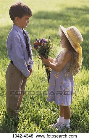people, hat, flowers, outdoors, friends, gift, present View Large Photo Image Stock Photo - people, hat, flowers, outdoors, friends, gift, present. Fotosearch