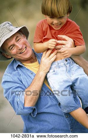 people, hat, laughing, outdoors, denim, grandfather, male bonding View Large Photo Image Stock Image - people, hat, laughing, outdoors, denim, grandfather, male bonding. Fotosearch