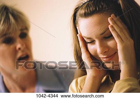 people, headache, mother, overwhelmed, stress, family, daughter View Large Photo Image Picture - people, headache, mother, overwhelmed, stress, family, daughter. Fotosearch