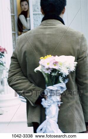 people, hiding, couple, daisies, flowers, back, lifestyles View Large Photo Image Stock Photo - people, hiding, couple, daisies, flowers, back, lifestyles. Fotosearch