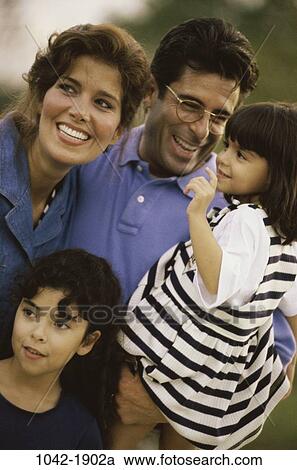 people, Hispanic, laughing, outdoors, family, daughters, togetherness View Large Photo Image Stock Image - people, Hispanic, laughing, outdoors, family, daughters, togetherness. Fotosearch