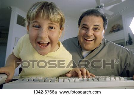 Stock Image - people, home, computer, laughing, awe, Middle-aged, joyous. Fotosearch