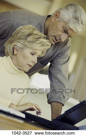 people, home, couple, technology, senior, computer, laptop View Large Photo Image Stock Photo - people, home, couple, technology, senior, computer, laptop. Fotosearch