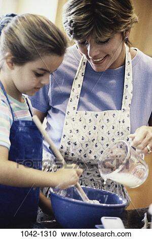 people, home, mother, pouring, bowl, family, learning View Large Photo Image Stock Image - people, home, mother, pouring, bowl, family, learning. Fotosearch