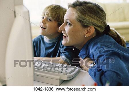 people, home, smiling, mother, computer, happy, laughing View Large Photo Image Stock Photograph - people, home, smiling, mother, computer, happy, laughing. Fotosearch