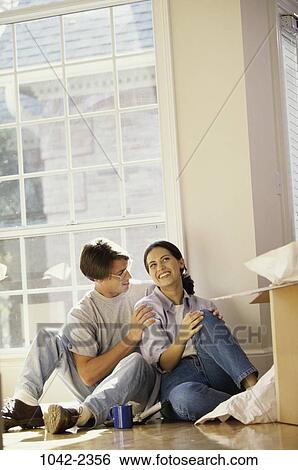 people, home, smiling, moving, couple, resting View Large Photo Image Stock Photograph - people, home, smiling, moving, couple, resting. Fotosearch