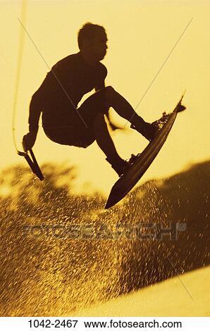 people, jumping, yellow, spraying, outdoors, sports View Large Photo Image Stock Photo - people, jumping, yellow, spraying, outdoors, sports. Fotosearch