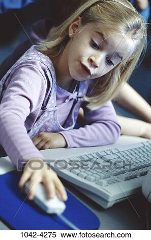 Stock Photography - people, keyboard, playing, mouse, computer, girl, child. Fotosearch