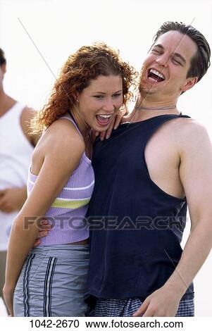 people, laughing, young, couples outdoors, hugging, joyous, romance View Large Photo Image Stock Image - people, laughing, young, couples outdoors, hugging, joyous, romance. Fotosearch