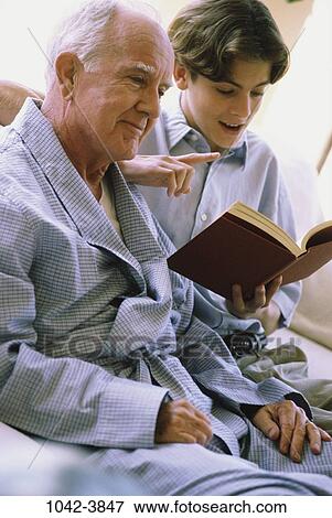 people, listening, senior, reading, book, family, grandfather View Large Photo Image Stock Photo - people, listening, senior, reading, book, family, grandfather. Fotosearch