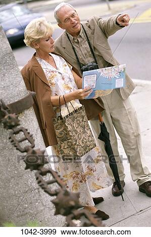 people, lost, umbrella, couple, map, senior, reading View Large Photo Image Stock Photo - people, lost, umbrella, couple, map, senior, reading. Fotosearch
