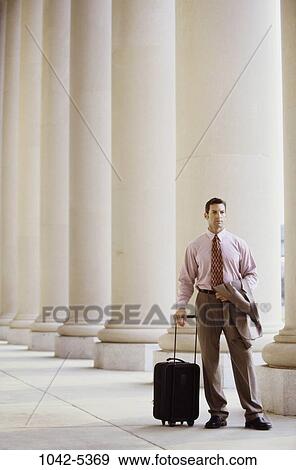 Stock Photo - people, luggage, business, outdoors, transportation, businessman. Fotosearch