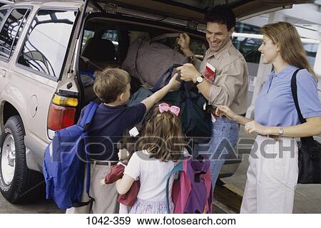 Stock Photo - people, luggage, outdoors, family, vacation, parents. Fotosearch