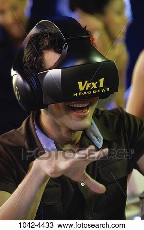 Stock Image - people, male, laughing, entertainment, game, fun. Fotosearch
