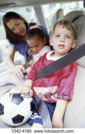Stock Photography - people, mother, car, ball, outdoors, family, helping. Fotosearch