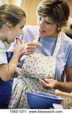 people, mother, cooking, family, apron, kitchen, daughter View Large Photo Image Stock Image - people, mother, cooking, family, apron, kitchen, daughter. Fotosearch