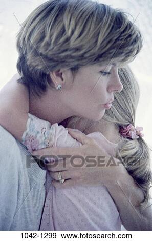 people, mother, holding, nurturing, family, blond, comforting View Large Photo Image Stock Photo - people, mother, holding, nurturing, family, blond, comforting. Fotosearch