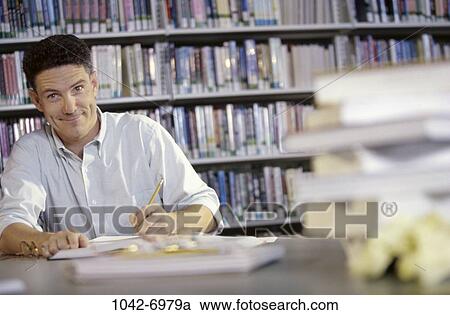 people, night, books, notebook, studying, library View Large Photo Image Stock Image - people, night, books, notebook, studying, library. Fotosearch