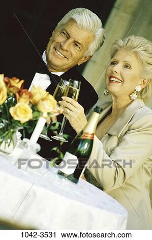 people, party, formal, celebration, couple, toasting, senior View Large Photo Image Stock Image - people, party, formal, celebration, couple, toasting, senior. Fotosearch