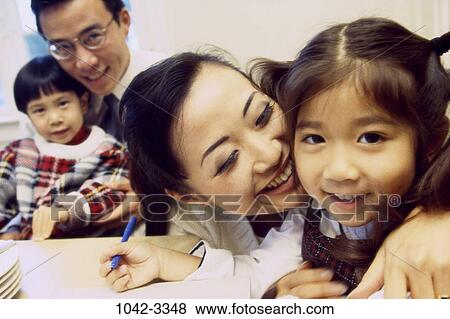 people, pen, smiling, Asian, eyeglasses, sitting, mother View Large Photo Image Stock Photo - people, pen, smiling, Asian, eyeglasses, sitting, mother. Fotosearch