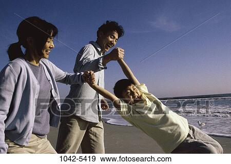 people, playing, Asian, beach, swinging, swing View Large Photo Image Stock Photo - people, playing, Asian, beach, swinging, swing. Fotosearch