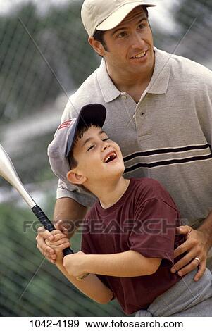 Stock Photo - people, playing, bat, baseball, swinging, swing, outdoors. Fotosearch