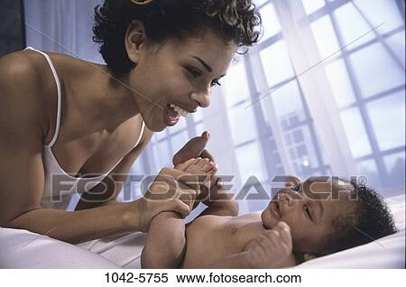 people, playing, excitement, window, sitting, mother View Large Photo Image Stock Photography - people, playing, excitement, window, sitting, mother. Fotosearch