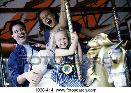 people, playing, laughing, riding, horse, carnival, lifestyles View Large Photo Image Picture - people, playing, laughing, riding, horse, carnival, lifestyles. Fotosearch