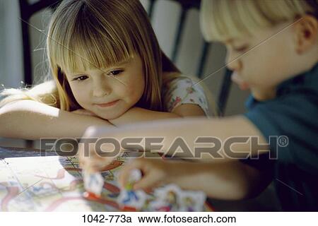 people, playing, lifestyles, resting, games, serious, sweet View Large Photo Image Stock Image - people, playing, lifestyles, resting, games, serious, sweet. Fotosearch