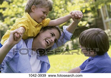 people, playing, mother, holding, playful, outdoors View Large Photo Image Stock Photo - people, playing, mother, holding, playful, outdoors. Fotosearch