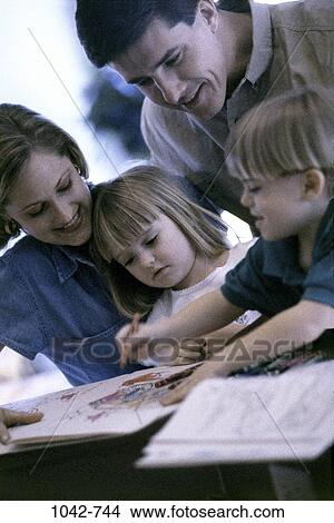 people, playing, sitting, watch, coloring, watching, family View Large Photo Image Picture - people, playing, sitting, watch, coloring, watching, family. Fotosearch