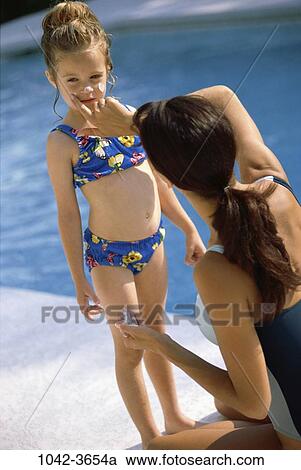 Stock Image - people, pool, mother, outdoors, nurturing, family, daughter. Fotosearch