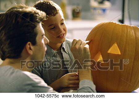 people, pumpkin, watch, concentrating, looking, watching View Large Photo Image Stock Image - people, pumpkin, watch, concentrating, looking, watching. Fotosearch