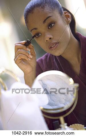people, reflection, woman, mirror, bathrobe, cosmetics, indoors View Large Photo Image Stock Photograph - people, reflection, woman, mirror, bathrobe, cosmetics, indoors. Fotosearch