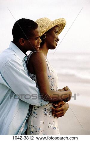 people, relaxation, hat, couple, beach, romantic, tranquility View Large Photo Image Stock Image - people, relaxation, hat, couple, beach, romantic, tranquility. Fotosearch