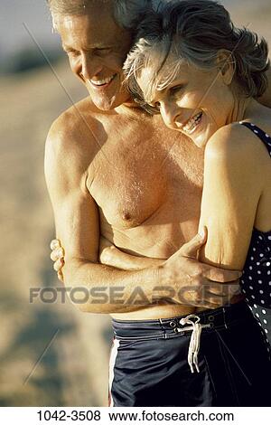 people, relaxation, smiling, couple, senior, beach, hugging View Large Photo Image Stock Photo - people, relaxation, smiling, couple, senior, beach, hugging. Fotosearch