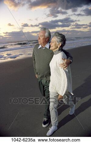 people, relaxation, walking, couple, senior, beach, relaxing View Large Photo Image Stock Image - people, relaxation, walking, couple, senior, beach, relaxing. Fotosearch