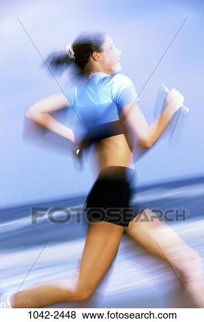 people, running, woman, Hispanic, beach, shorts, jogging View Large Photo Image Stock Photo - people, running, woman, Hispanic, beach, shorts, jogging. Fotosearch