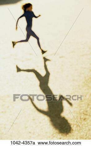 people, running, woman, shadow, jogging, outdoors, speed View Large Photo Image Stock Image - people, running, woman, shadow, jogging, outdoors, speed. Fotosearch