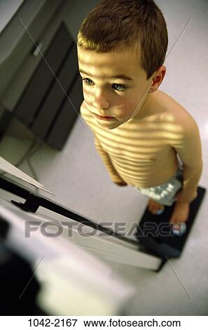 Stock Photo - people, shadow, physical, boy, health, child, weight. Fotosearch
