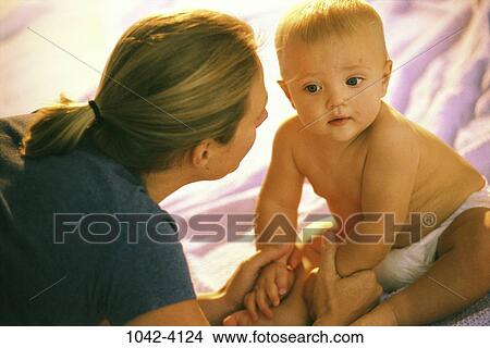 people, sitting, mother, baby, holding, family View Large Photo Image Picture - people, sitting, mother, baby, holding, family. Fotosearch