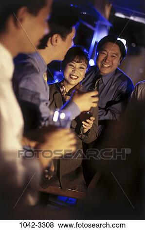 people, smiling, Asian, toasting, drinking, bar, Middle-aged View Large Photo Image Stock Photo - people, smiling, Asian, toasting, drinking, bar, Middle-aged. Fotosearch