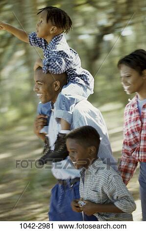 people, smiling, autumn, walking, pointing, outdoors, forest View Large Photo Image Stock Image - people, smiling, autumn, walking, pointing, outdoors, forest. Fotosearch