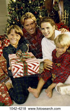 people, smiling, Christmas, joyous, smile, family, gifts View Large Photo Image Stock Photo - people, smiling, Christmas, joyous, smile, family, gifts. Fotosearch