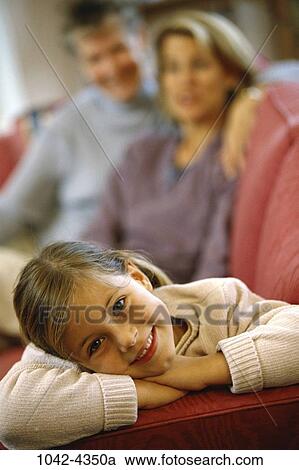 people, smiling, couch, relaxing, resting, foreground, smile View Large Photo Image Stock Image - people, smiling, couch, relaxing, resting, foreground, smile. Fotosearch