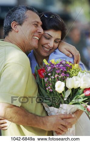 people, smiling, couple, Hispanic, flowers, outdoors, romantic View Large Photo Image Stock Image - people, smiling, couple, Hispanic, flowers, outdoors, romantic. Fotosearch